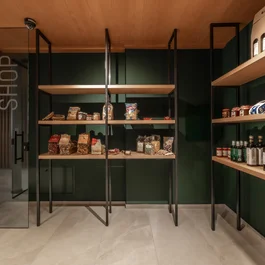 Modern small shop with shelves stocked with food and drinks