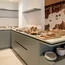 Buffet with bread, cold cuts, and fruit in modern breakfast room